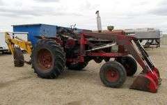 E-1267 McCormick Farmall 806 Tractor W/ Backhoe Attachment