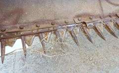 M-1289  New Holland Pull Swather