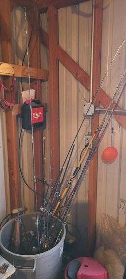 Garbage Can full of Fishing Poles