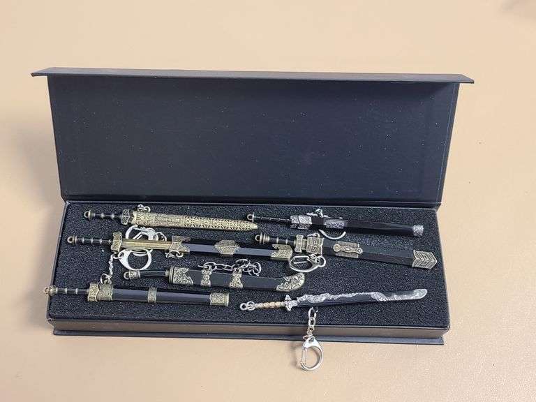 7) Mini Sword Keychains with Removable Swords