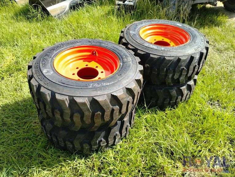 Set of Four Unused 12-16.5 Skid Steer Tires On Wheels