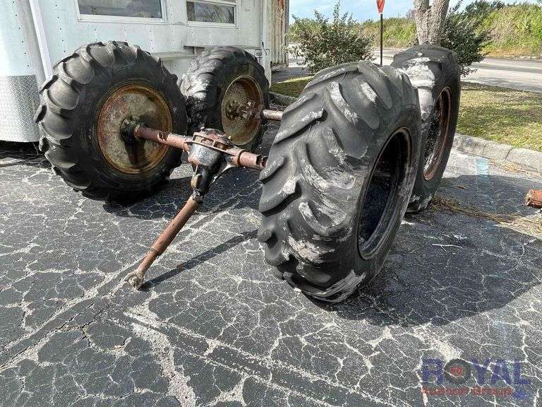 Lot of 2 Rear Axles with Bar Tread Tractor tires and Wheels Royal