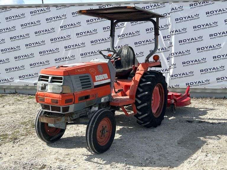 Kubota L3300 35HP Utility Tractor with Caroni TC710 6ft. Rotary Brush Mower Attachment