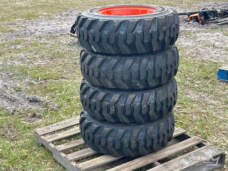 Lot of 4 10-16.5N.H.S. Skid Steer Wheels and Tires