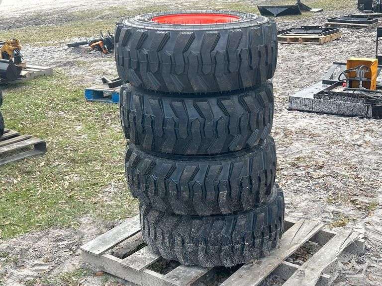 Lot of 4 12-16.5N.H.S. Skid Steer Wheels and Tires