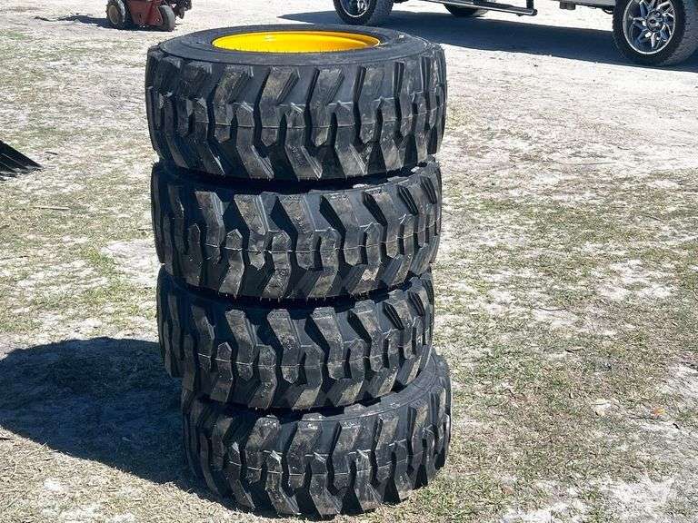 Unused 12-16.5NHS Skid Steer Wheels and Tires