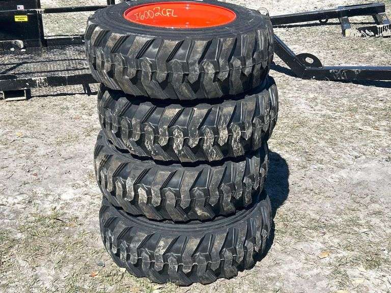 Unused 10-16.5NHS Skid Steer Wheels and Tires