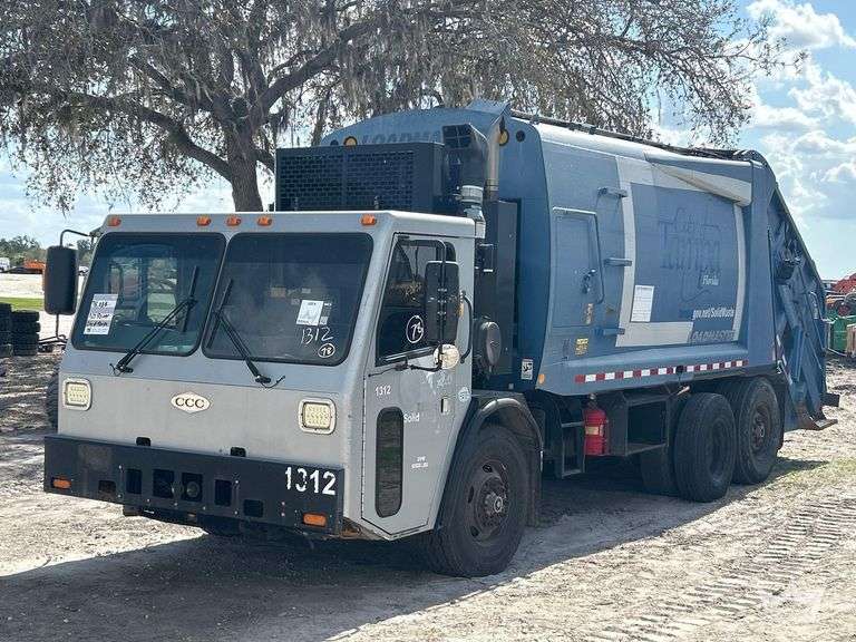 2013 Crane Carrier Co. Low Entry T/A 25Yd Rear Loader Garbage Truck
