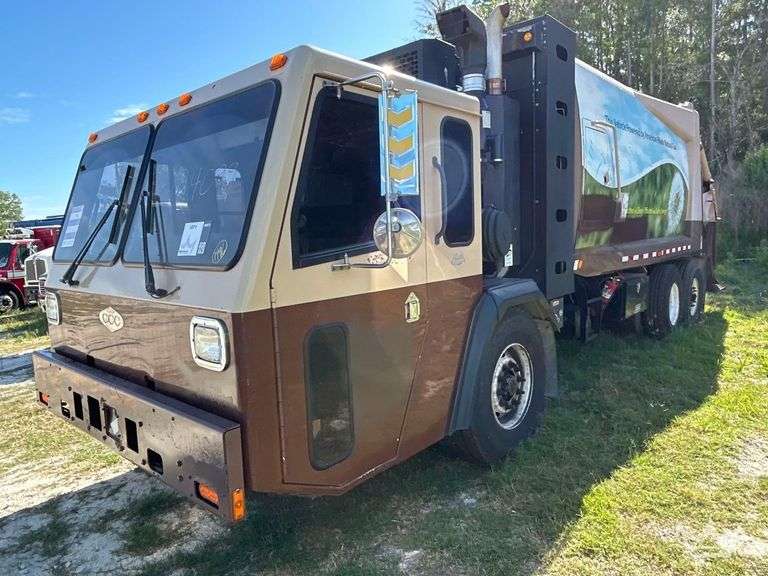2014 Crane Carrier Co. Low Entry T/A Rear Loader Garbage Truck