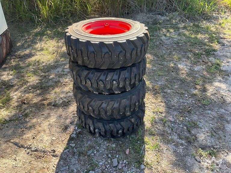 Set of 4 Unused 10-16.5N.H.S. ForeRunner Skid Steer Wheels and Tires
