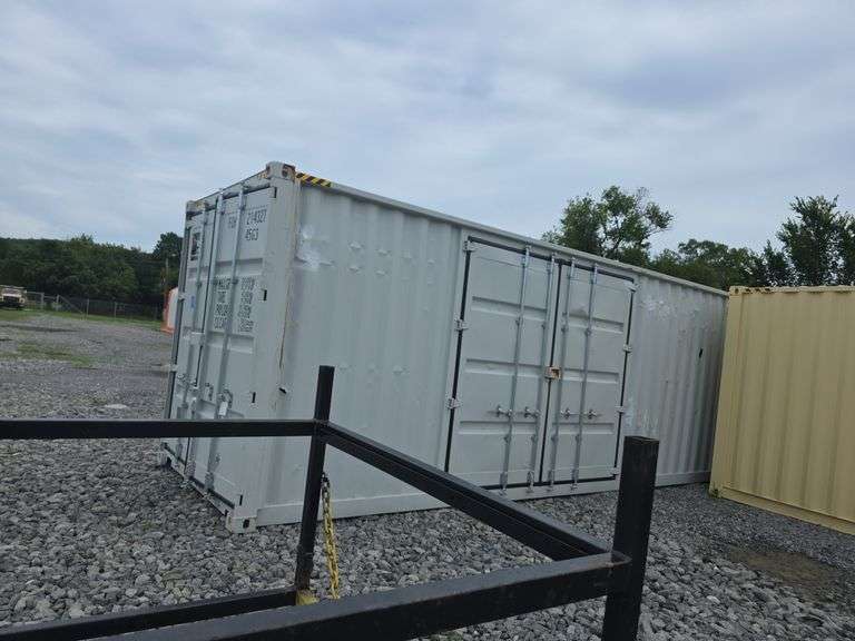 40' High Cube Container w/ 2 side doors - has some damage to the outside and one hole