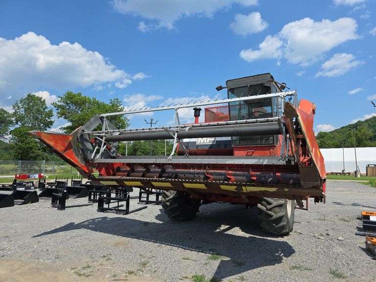 Massey 750 Combine w/ corn & grain heads