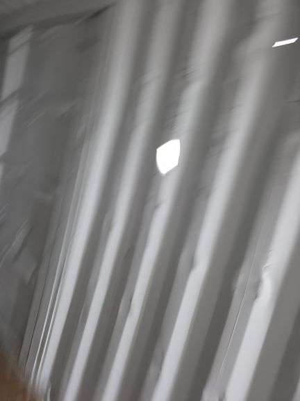 40' High Cube Container w/ 2 side doors - has some damage to the outside and one hole