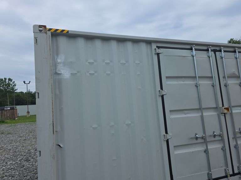 40' High Cube Container w/ 2 side doors - has some damage to the outside and one hole