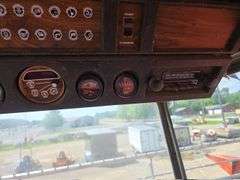Massey 750 Combine w/ corn & grain heads