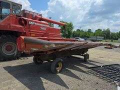 Massey 750 Combine w/ corn & grain heads