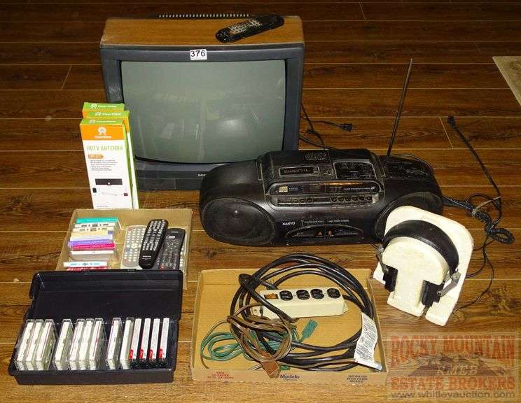 Sanyo Dual Cassette Boom Box, Cassette Tapes, Power Strip, Modular Component Systems Headphones, HDTV Antennas & Samsung 19" TV W/ Remote. All for one money.