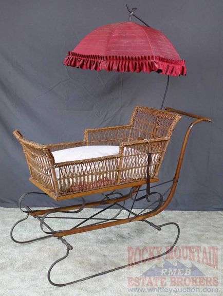 Very Hard to Find Victorian Wicker Push Sled W/ Parasol. The wicker and parasol are both in very good condition. This is a hard to find piece. Come check it out in person. 32"x46"x16.5".