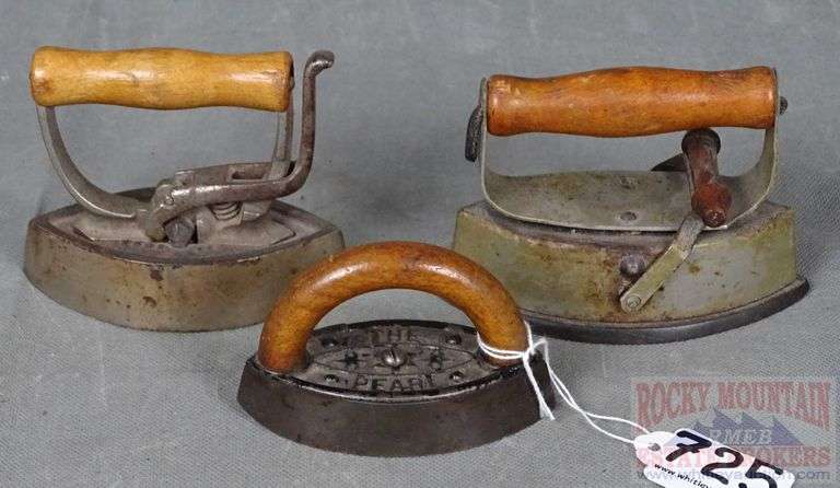 3 Small Size Antique Sad Irons W/ Wood Handles.  Three times the money.  Total bid is quantity times bid price.