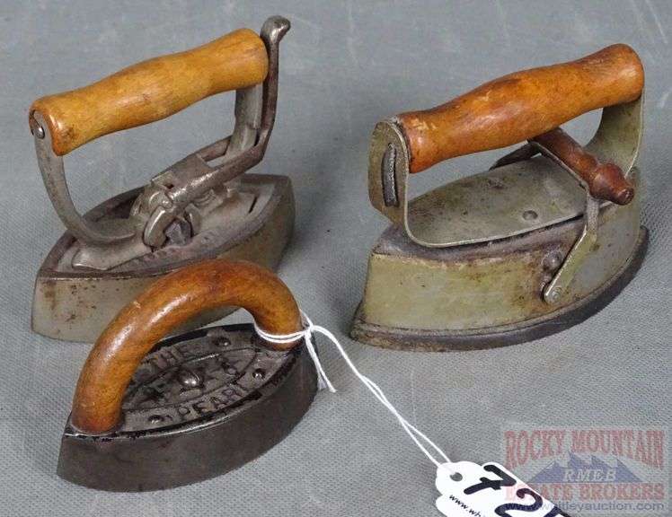 3 Small Size Antique Sad Irons W/ Wood Handles.  Three times the money.  Total bid is quantity times bid price.