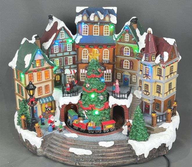 Brand New 15" Pre-Lit Holiday Village W/ Music & Animation. 27 LED lights and great attention to detail make this a great addition to your Holiday decor.