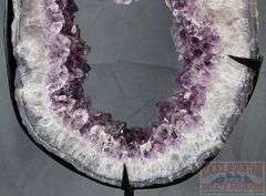 Unique Amethyst Geode Slice on Metal Stand – Elegant Open Design.