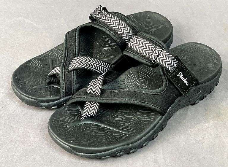 Brand New Ladies Size 9, Skechers Reggae Slide Sandal, Black with White Stitching.