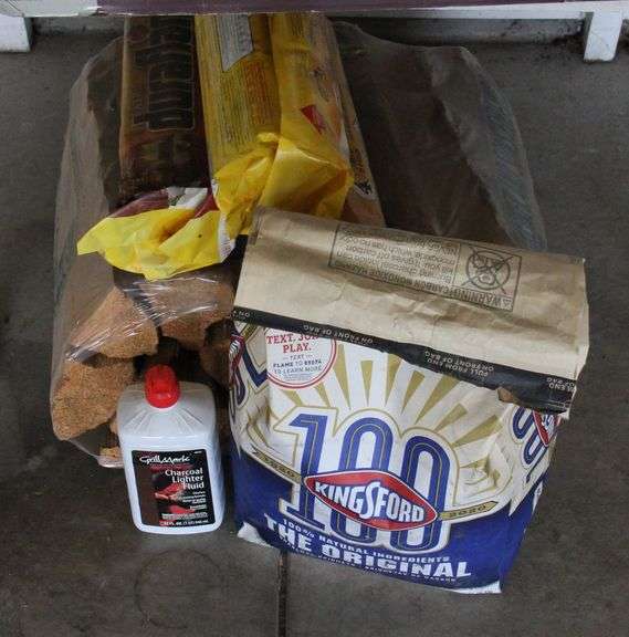 Two bundles of firewood, fire place logs, charcoal and lighter fluid.