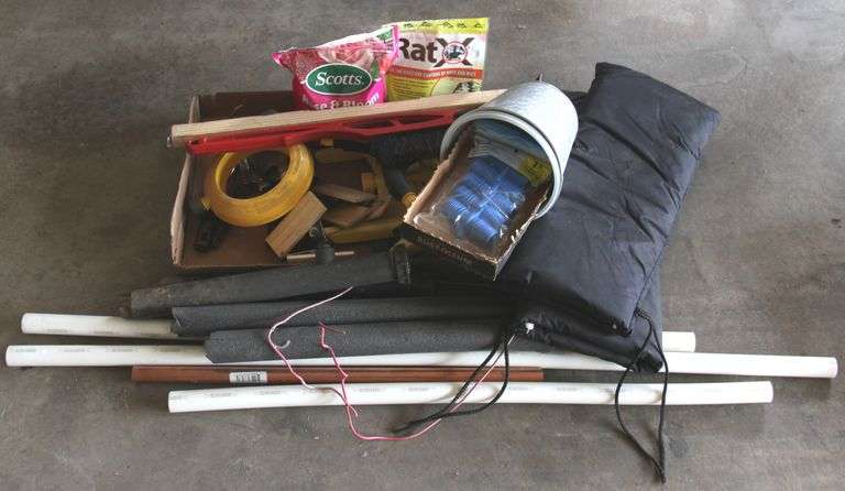 Batch of lawn and garden tools and supplies to include irrigation parts and knee pads.
