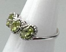 Elegant Sterling Silver Dress Ring W/ 3 Approx.1-Carat Oval Cut Peridot, Prong Set Peridot Accent Stones, Size 8.