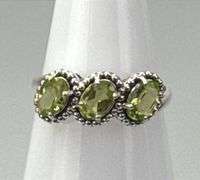 Elegant Sterling Silver Dress Ring W/ 3 Approx.1-Carat Oval Cut Peridot, Prong Set Peridot Accent Stones, Size 8.