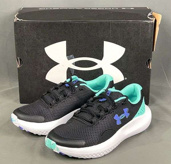 Brand New Youth Size 6, Under Armour Black/Green GGA Surge  4. MSRP $55.00