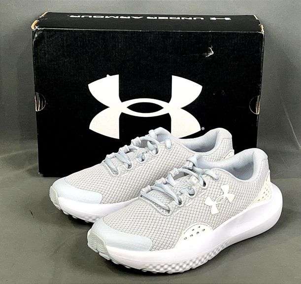 Brand New Youth Size 6, Grey/White Under Armour GGS Surge 4. MSRP $55.00