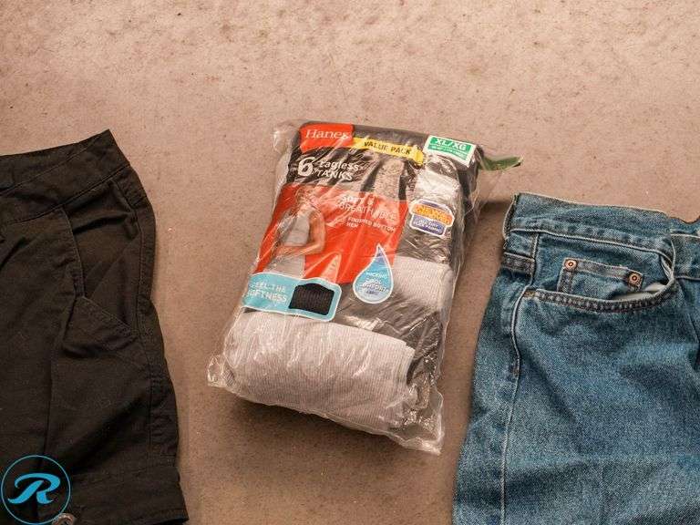 Tray of Men's Clothing: Pants 4XL & 31x30 and Hanes Tank Top - Roller Auctions