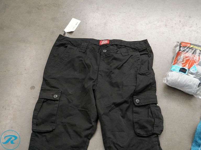 Tray of Men's Clothing: Pants 4XL & 31x30 and Hanes Tank Top - Roller Auctions