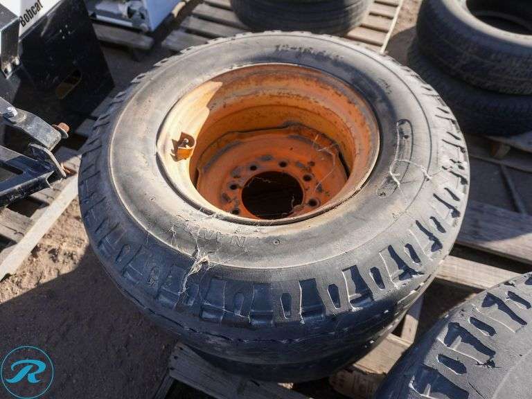 Set Of (4) Used 12-16.5 Skid Steer Tires w/ Wheels, Foam Filled - Roller Auctions