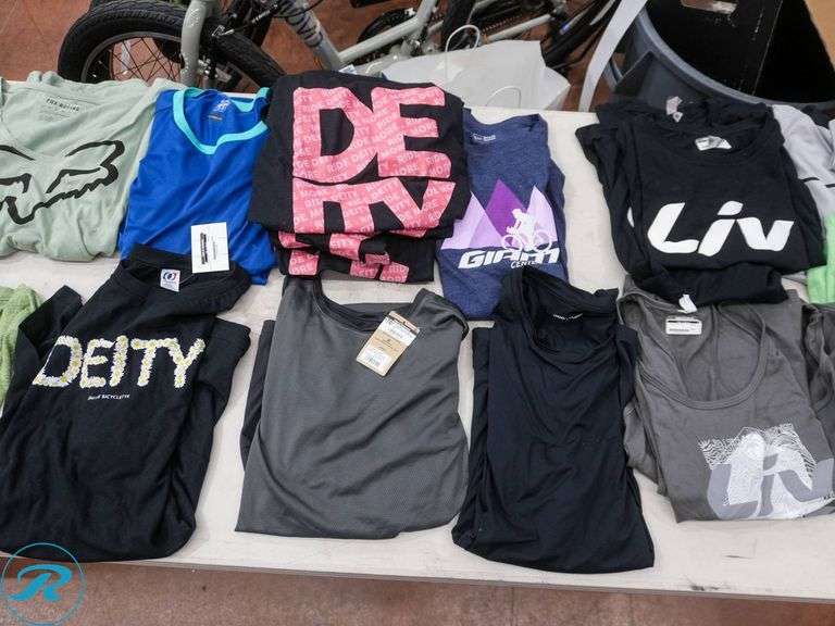 Crate of (26) Women's Cycling Shirts, Size L/XL, Assorted Brands - Roller Auctions