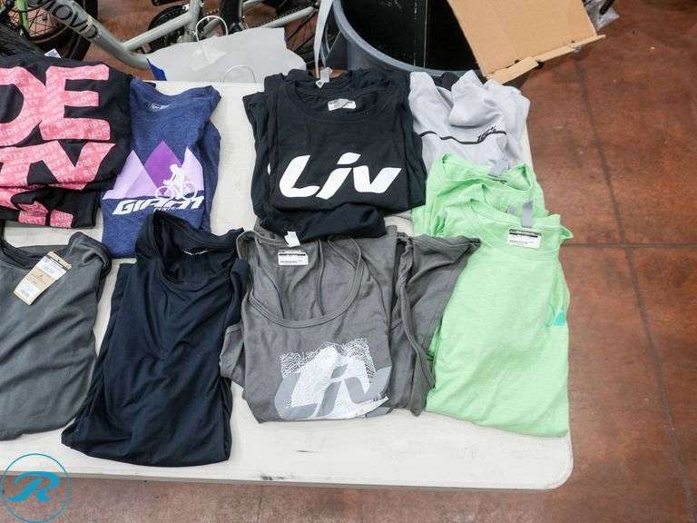 Crate of (26) Women's Cycling Shirts, Size L/XL, Assorted Brands - Roller Auctions