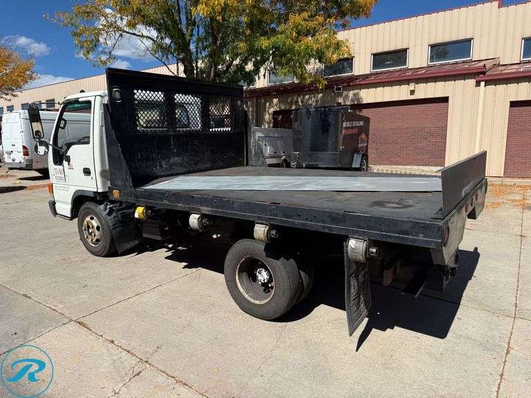 1999  Isuzu  NPR   4X2  Flatbed Dump Truck - Roller Auctions