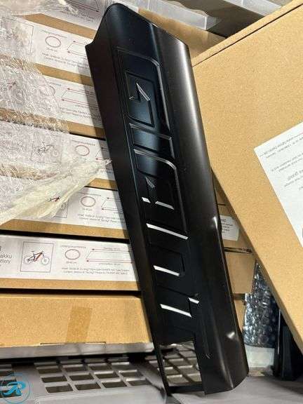 Crate Containing E-Bike Accessories Including Giant Battery Cover, AKKU Bike Covers, and Tire Size Chart - Roller Auctions