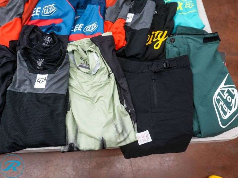 Crate of (47) Youth Cycling Shirts, Assorted Brands and Sizes - Roller Auctions