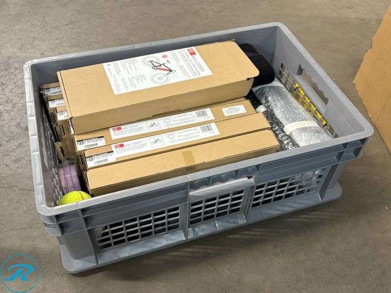 Crate Containing E-Bike Accessories Including Giant Battery Cover, AKKU Bike Covers, and Tire Size Chart - Roller Auctions