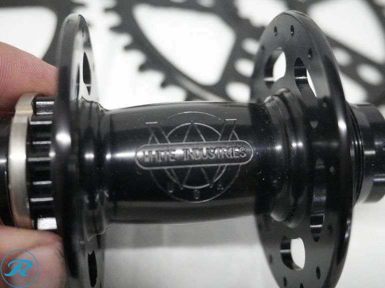 White Industries Bicycle Components Set with Paul Components Including Hubs, Chainrings, and Crank Arms with ‘The One’ Branding - Roller Auctions