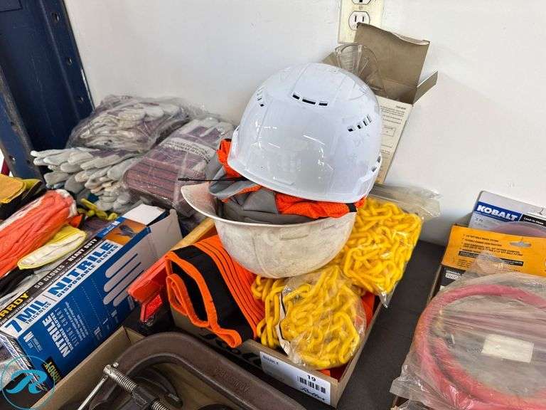Personal Protective Equipment Including Hard Hats, Safety Vests, Ear Plugs, and Safety Chains
