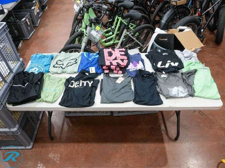 Crate of (26) Women's Cycling Shirts, Size L/XL, Assorted Brands - Roller Auctions