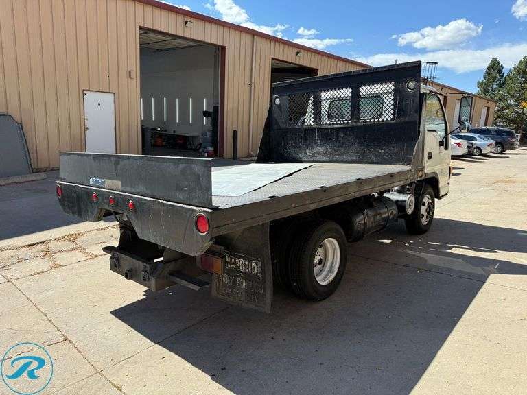 1999  Isuzu  NPR   4X2  Flatbed Dump Truck - Roller Auctions