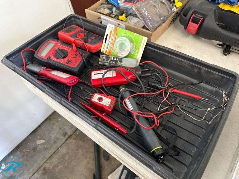Tray of Electrical Testing Tools Including Multimeters and Test Probes