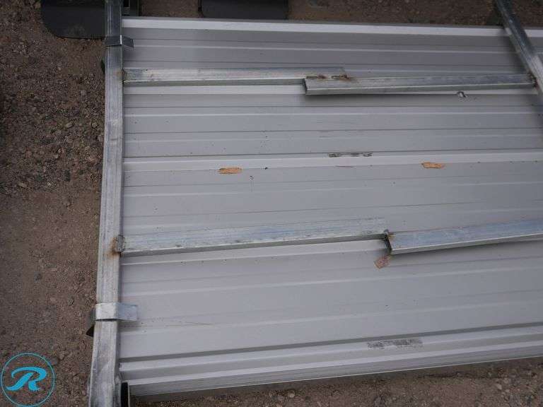 (100) New Sheets of KJ K0311 Galvalume Corrugated Steel Panels, 10' x 35" (Damage to Top Few Sheets) - Roller Auctions