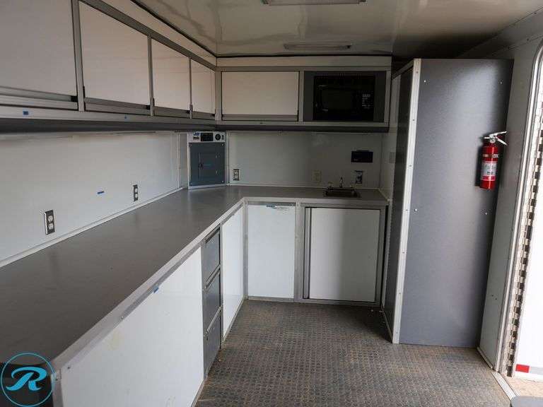 Hook Lift Roll-Off Custom Lab Bed, w/ Air Conditioning, Cabinets, Counters, Electrical, Lighting, 20' Long x 102" Wide x 91" High, Onan Gas Generator - Roller Auctions