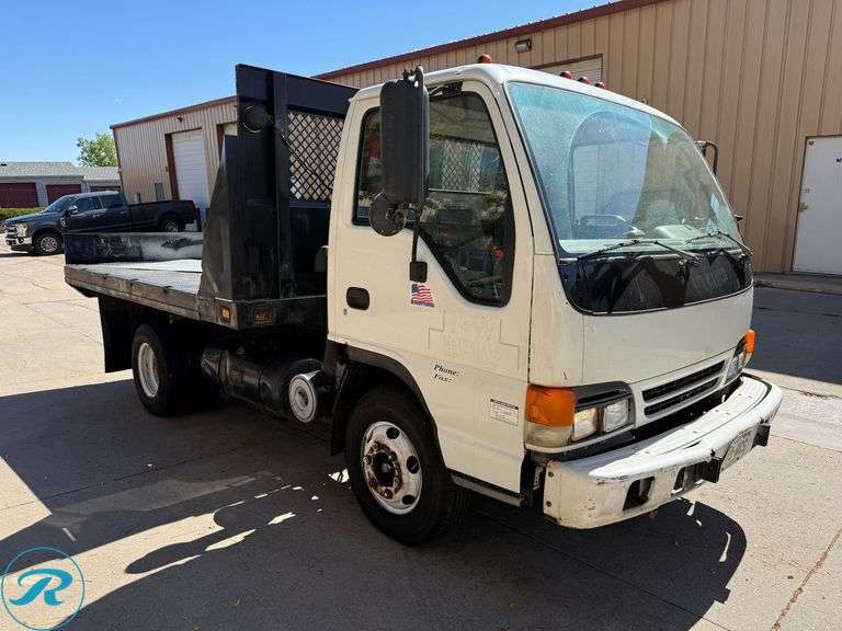 1999  Isuzu  NPR   4X2  Flatbed Dump Truck - Roller Auctions